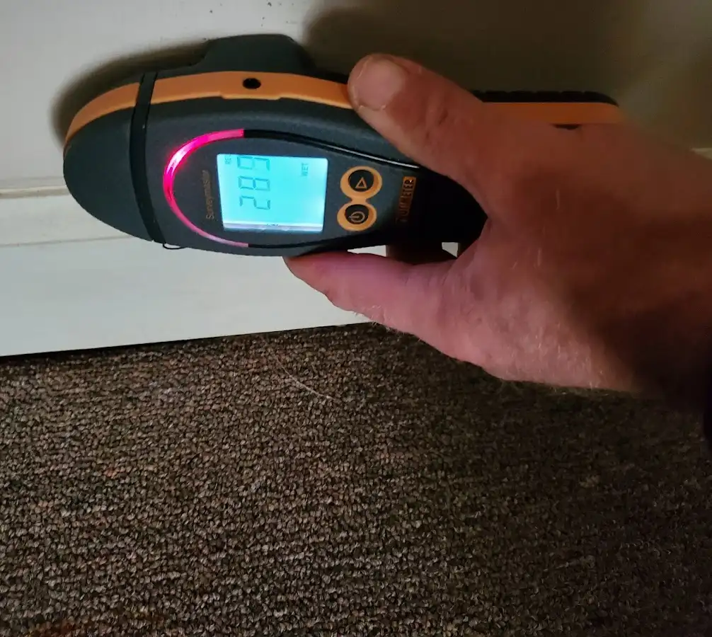 Moisture detection at baseboard during Storm Damage Restoration in Rockton